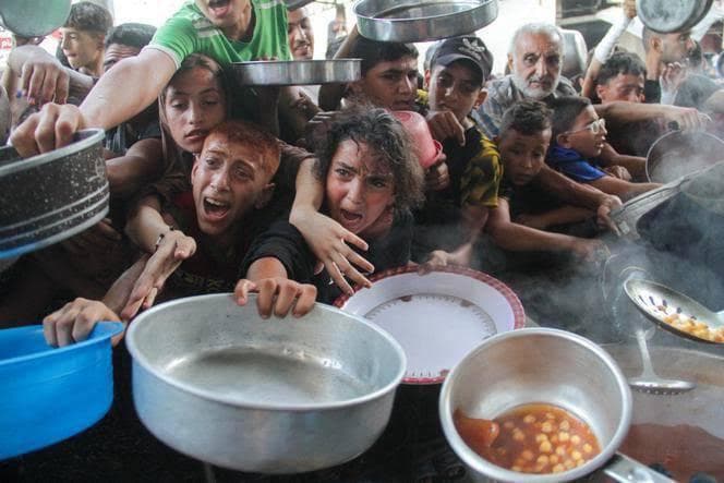 Palestinian families receiving humanitarian aid